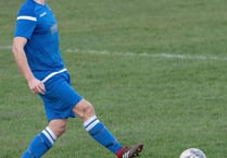 Town lose- but stay top