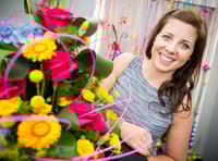 Florist Charlotte arranges a tilt at the title