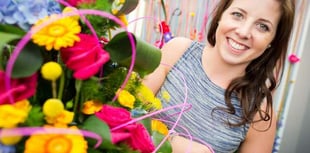 Florist Charlotte arranges a tilt at the title