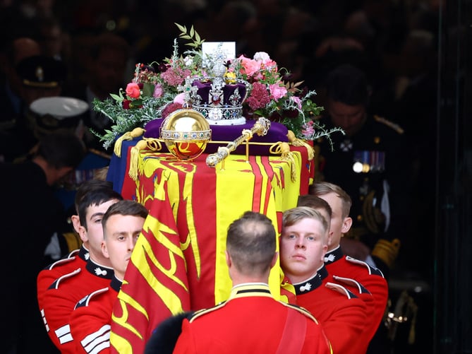 The coffin is carried out following the State Funeral of Queen Elizabeth II, held at Westminster Abbey, London. Picture date: Monday September 19, 2022.