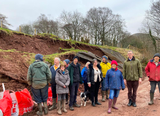 David Davies MP with local residents at the Capel-y-Ffin landslip.