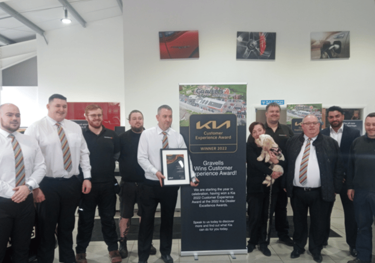 Pictured above are staff at Gravells Kia and left, general manager Cawryn Evans with Kia marketing director Sanke De Silva.