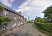 School catchment split on village's main road ended