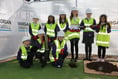 Children bury a time capsule on new 
school site in Abergavenny