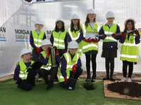 Children bury a time capsule on new 
school site in Abergavenny