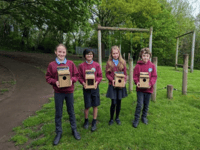 Llantilio Pertholey School pupils make bird boxes with a little help!