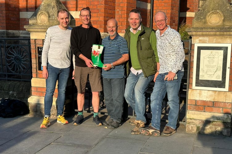 From left, Dave Thorne (Wellington), Simon Buttars (Wellington), Gary Hortop (Aber), Peter Shaw (Wellington), Mike Logan (Aber) with the 'Welly'