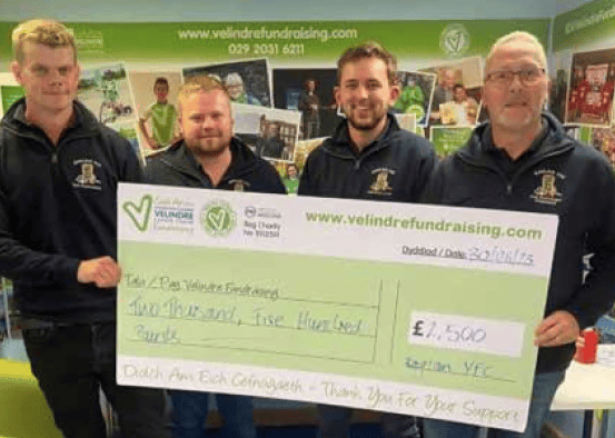 Raglan Young Farmers hand over cash to charity