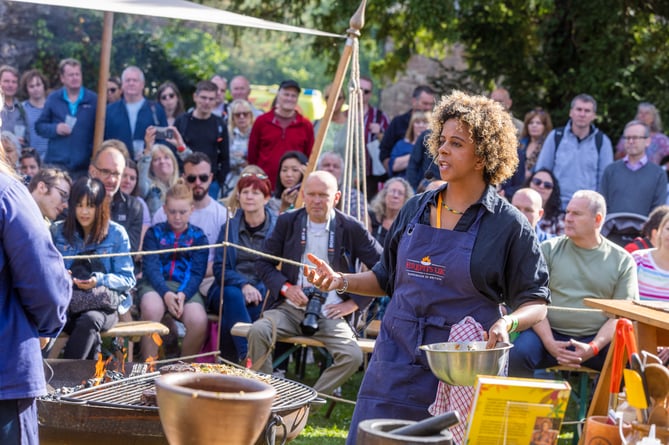 Melissa Thompson cooking over fire