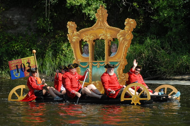 Charles and Camilla enjoy a ride down the Wye on their royal carriage