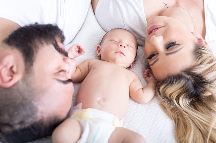 A newborn baby with parents