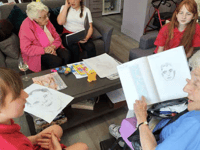 Primary school pupil helping to bridge the generation gap with care home visits