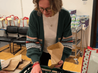Labour candidate wraps Christmas food parcels for local families