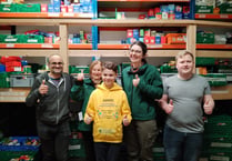 Local schoolboy helps out at Foodbank as part of fundraising mission