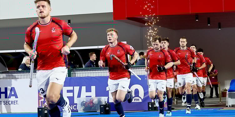 Jacob Draper, second from left, runs out with the GB hockey team