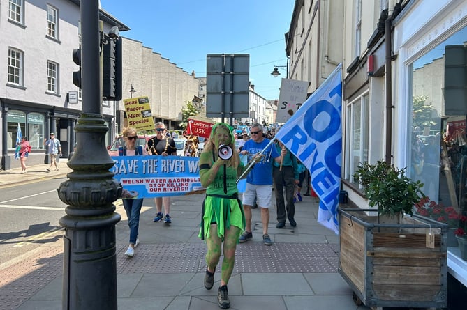 Angela leads protest through Brecon in 2023