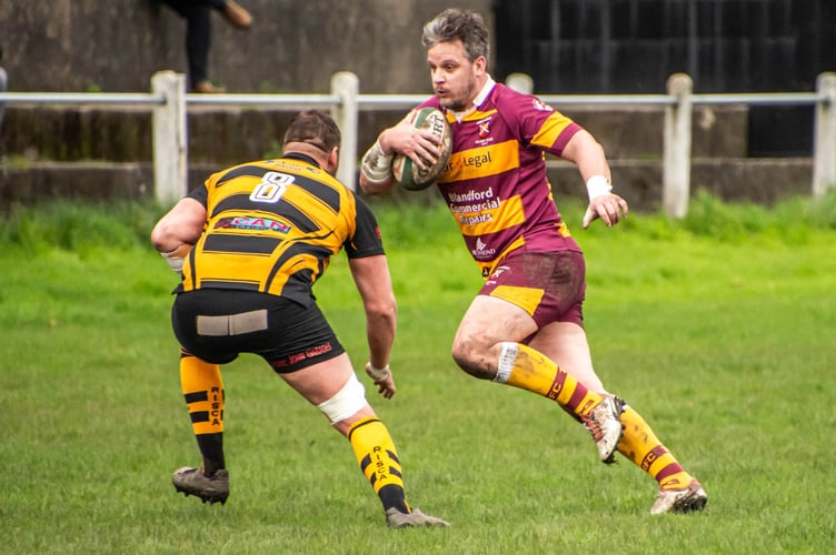 An Abergavenny player makes a break