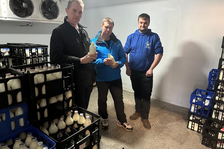 Monmouth MP David Davies (left) with James Durose (right) and Cllr Richard John at Raglan Dairy.