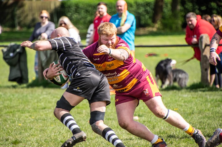 A Nelson player is halted in his tracks