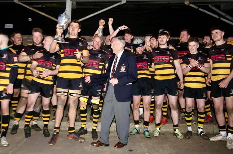 Crickhowell RFC's players celebrate retaining the Ivor Jones Cup. Photo: Crickhowell RFC.