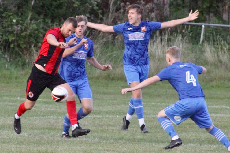 A tight battle for the ball in Friday's Abergavenny Town v Goytre clash. 