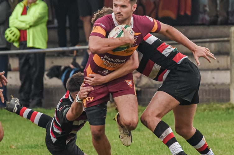 Pontypool players try to stop an Aber player breaking through