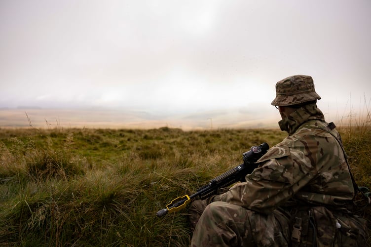 A soldier from 3 Royal Military Police Regiment watches the horizon for enemy movement during EXERCISE CAMBRIAN PATROL 2024.

Soldiers from across the world are readying themselves for the ultimate challenge of military fieldcraft, navigation, tactics, leadership skills and teamwork.
This all takes place across the undulating terrain of Bannau Brycheiniog (Brecon Beacons) where Exercise Cambrian Patrol has had its roots since 1959.

Around 1,000 troops, spread across eight phases of the event, will be faced with a mock mission that includes covering more than 40 miles from east to west, dealing with enemy threats and various other challenges.

Lieutenant Colonel Will Peltor, Officer Commanding this year's event, said: ÒAs we mark the 65th year since the first Exercise Cambrian Patrol took place itÕs important to note that the event maintains its core standards and is as relevant today, in the modern operational environment, as it was for Territorial Soldiers nearly seven decades ago when they were being tested on their Cold War readiness.