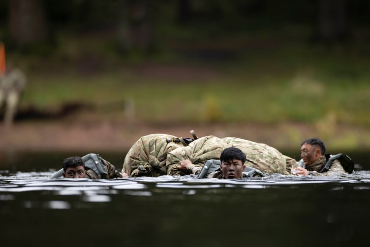 Gurkha soldiers from Gurkha Company (Sattang) crossing the river using makeshift life rafts made from their bivvy bags during EXERCISE CAMBRIAN PATROL 2024.
Soldiers from across the world are readying themselves for the ultimate challenge of military fieldcraft, navigation, tactics, leadership skills and teamwork.
This all takes place across the undulating terrain of Bannau Brycheiniog (Brecon Beacons) where Exercise Cambrian Patrol has had its roots since 1959.
Around 1,000 troops, spread across eight phases of the event, will be faced with a mock mission that includes covering more than 40 miles from east to west, dealing with enemy threats and various other challenges.
Lieutenant Colonel Will Peltor, Officer Commanding this year's event, said: ÒAs we mark the 65th year since the first Exercise Cambrian Patrol took place itÕs important to note that the event maintains its core standards and is as relevant today, in the modern operational environment, as it was for Territorial Soldiers nearly seven decades ago when they were being tested on their Cold War readiness.