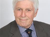 Abergavenny councillor tunes into meeting while driving to funeral