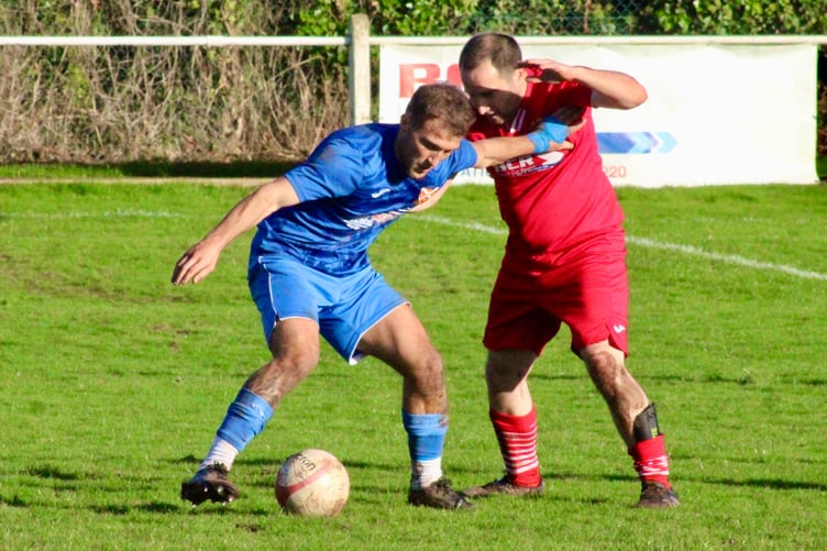 A Pennies player shields the ball at Corries' Rich Field ground