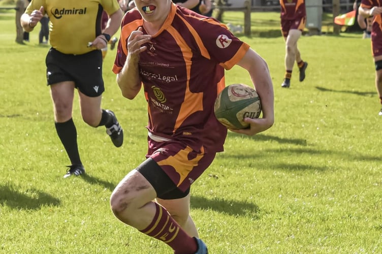A Quins player goes over for a try