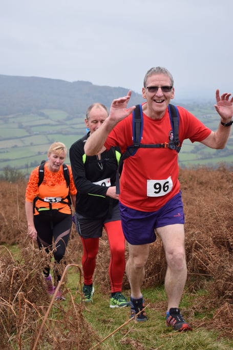 Smiles on the way up in the Sugar Loaf Winter Fell Race