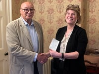 Fundraising group hands over charity cheques