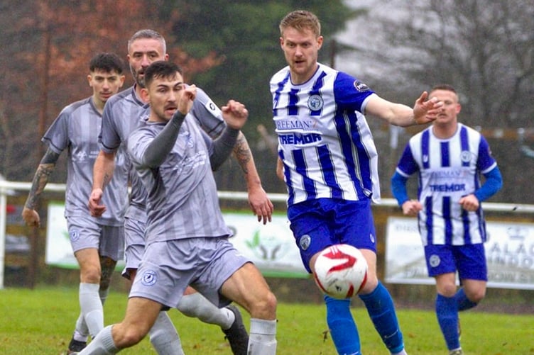 A Blaenavon Blues player challenges for the ball, right. Photo: Andrew Rees