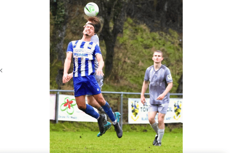 Heads you win as a Blues player jumps for the ball