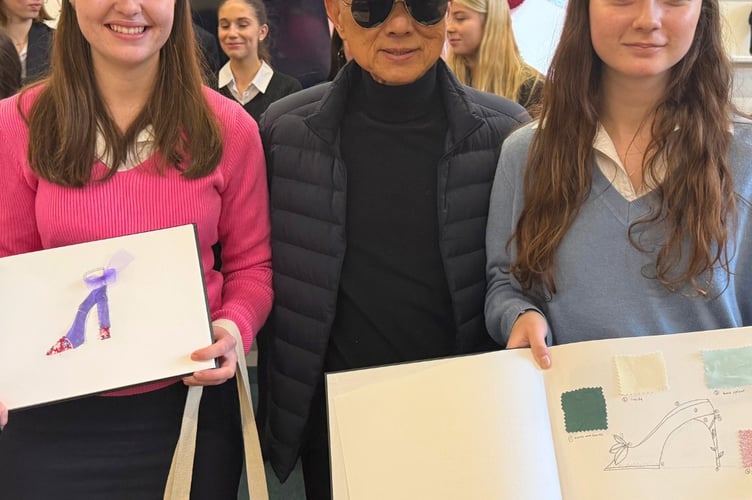 Jimmy Choo with two of the Monmouth School students at the workshop. Photo: Haberdashers Monmouth School