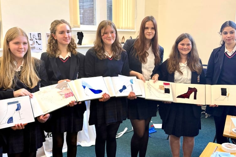 Students at the Jimmy Choo workshop show off their designs