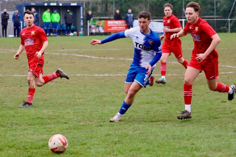 A Chepstow player wins the race for the ball