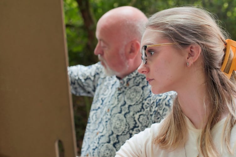 Oriane hard at work on her portrait alongside Bill
