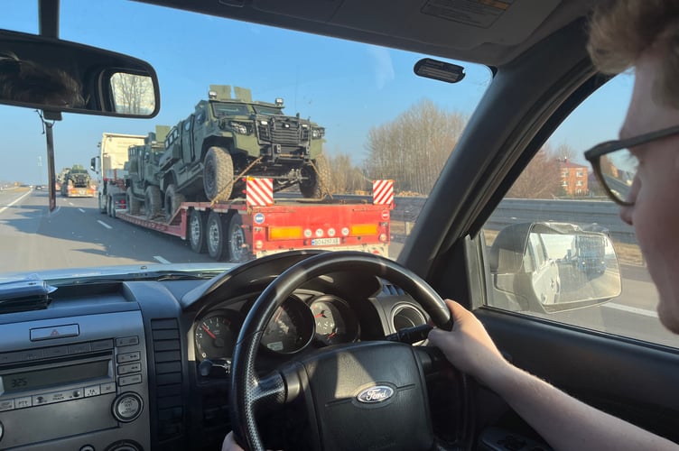 James driving passed a military convoy near the Ukraine border
