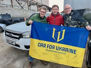 Father and son sending old 4x4s to the front