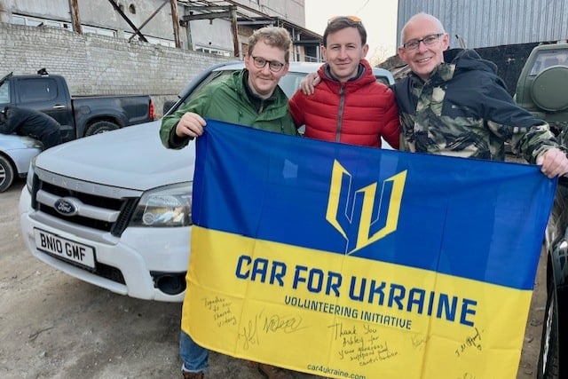 Ashley and James Hawkins with the Ford Ranger they donated to the Ukraine war effort