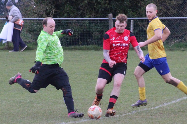 The keeper wins the race for a loose ball in Saturday's Mardy v Machen clash