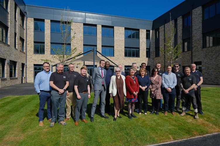  Leader Mary Ann Brocklesby and Chair of the Council Su McConnel, along with other Monmouthshire County Council staff, being handed the keys to the new King Henry VIII 3-19 school in Abergavenny by representatives of Morgan Sindall.