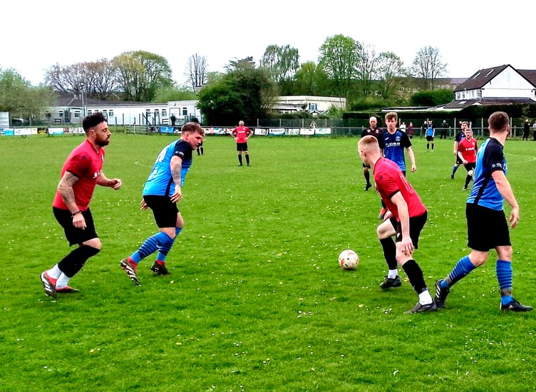 Mardy top scorers Ross Melrose and Nathan Price battle for possession.