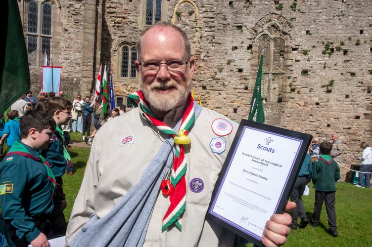 Barry Bradley was honoured for his 10 years volunteering for Raglan Scouts.