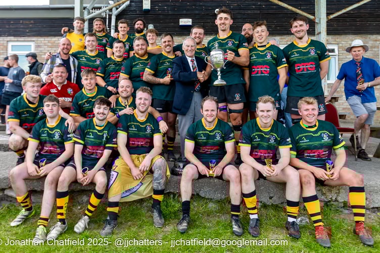 Crickhowell RFC players and supporters with the Ivor Jones Cup after winning it for the third year running. Photo: Jonathan Chatfield