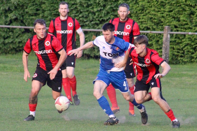 Goytre players battle with a Chepstow player