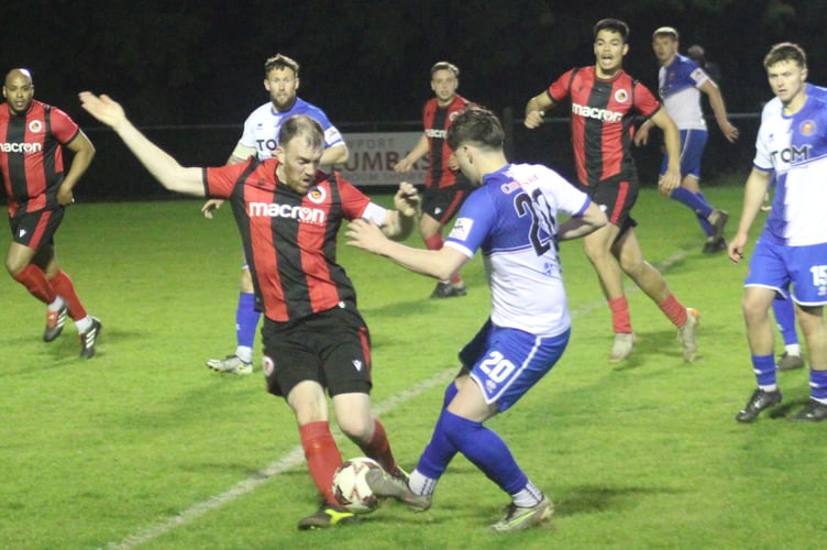 Players battle for the ball at Goytre's Plough Road ground