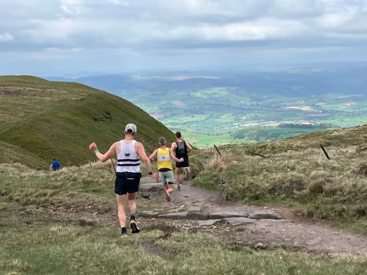 Runners start the steep  descent in the Talgarth Fell Race